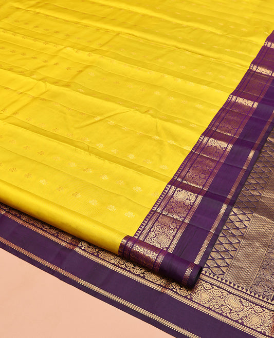 Yellow Vasundhara Silk Saree, Sparsely Woven with Zari Buttas, Contrast Rettai Pettu Border of Rekku, Muthu, Kathir, and Kodi Manga Designs, Intricate Pallu, and Contrast Blouse