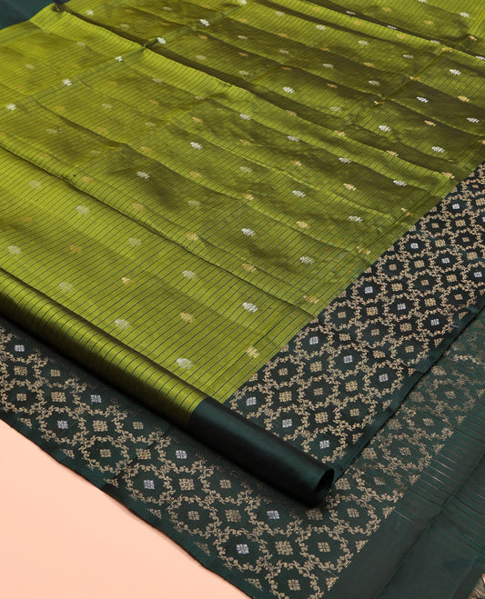 Green Mayuri Soft Silk Saree, Embellished with Buttas and Stripes, Complemented by a Contrast Jaal Border, Pallu of Jaal Designs, and a Contrast Blouse