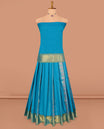 Blue Art Silk Pavadai Material Set, Delicately Woven with Zari Designs on Its Skirt, Complemented by a Contrast Paisley Zari Border, and a Matching Blouse