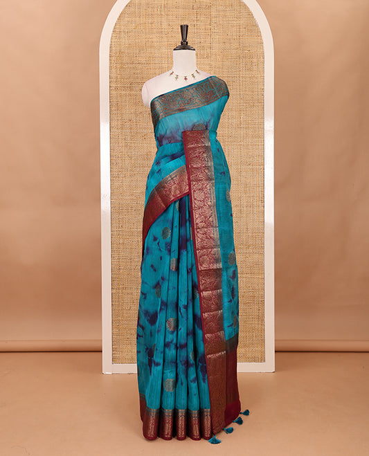 Rama blue all over zari butta with shibori-style printed jute cotton saree, contrast zari border, zari line weaving pallu & contrast blouse