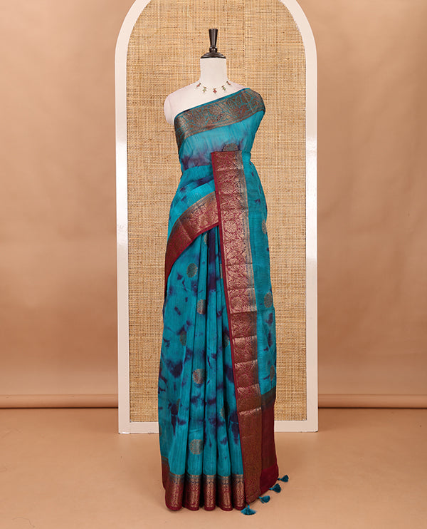 Rama blue all over zari butta with shibori-style printed jute cotton saree, contrast zari border, zari line weaving pallu & contrast blouse