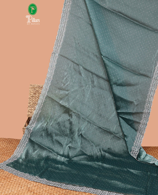 Blue all-over stone work burburry chiffion saree with self cutthana stone work border