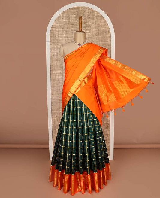 Green pure-silk half-saree, chakram butta enclosed checked skirt, contrast kodi visiry and mayil kann  border, zari design blouse, and manga butta enclosed jaal dhavani