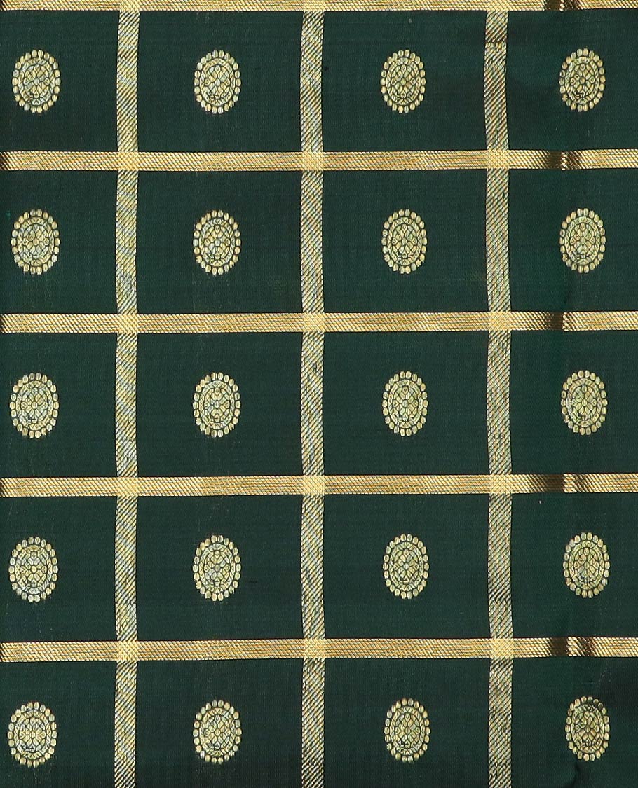 Green pure-silk half-saree, chakram butta enclosed checked skirt, contrast kodi visiry and mayil kann  border, zari design blouse, and manga butta enclosed jaal dhavani