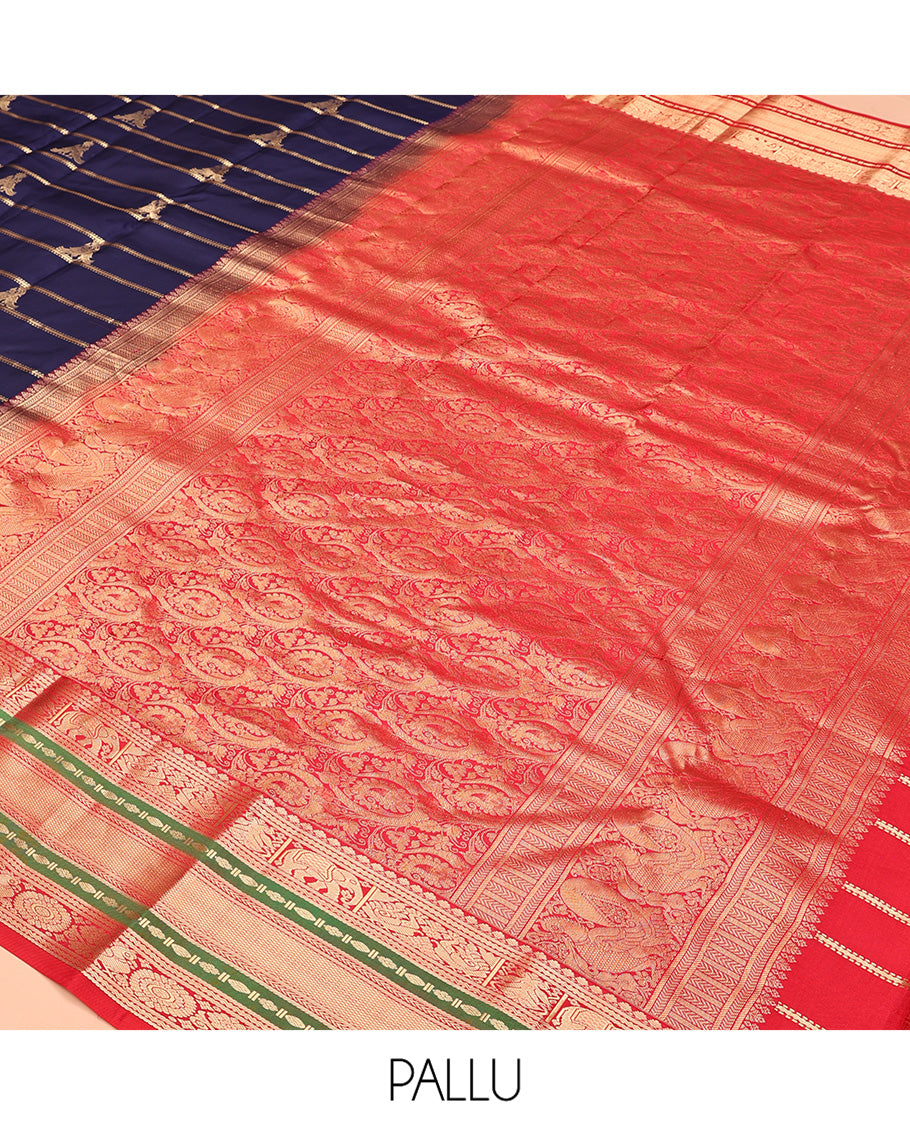 Blue Vasundhara Silk Saree, Accentuated with Zari Buttas and Stripes All Over Its Body, Complemented by a Contrast Border of Elephant, Mayil, and Chakram Designs, a Grand Pallu, and Paired with a Contrast Blouse