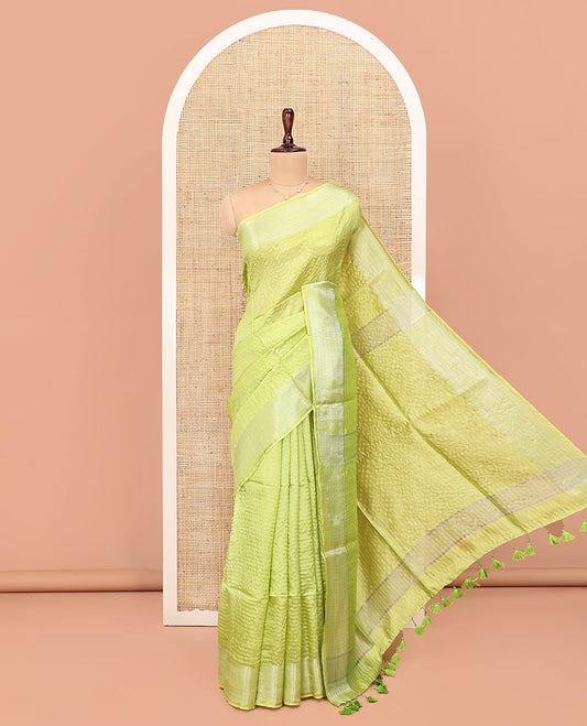 Green Banana Pith Saree, Sparsely Woven with Stripes All Over Its Body, Subtle Self-Border of Jaal Designs, Pallu Steeped with Stripes, and Paired with a Matching Blouse