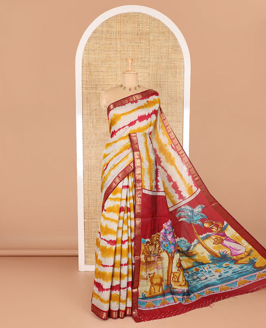 Yellow shibori printed muslin cotton saree, contrast peacock zari border, village scenery printed pallu, and a contrast polka dotted zari border blouse