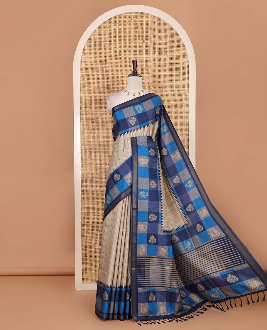 Chikku-blue plain kathan silk saree, contrast buttas enclosed multi-color checked blocks border, temple pallu, and contrast blouse of checks, and buttas