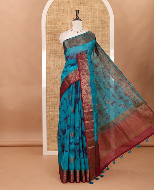 Rama blue all over zari butta with shibori-style printed jute cotton saree, contrast zari border, zari line weaving pallu & contrast blouse