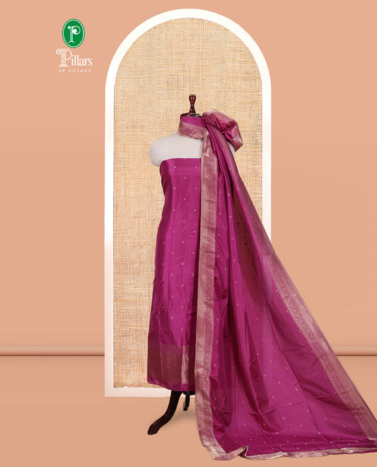 Rani Pink Semi-Silk Material Churidar Features Zari Buttas Woven Top, a Santoon Bottom, and Zari Design Dupatta