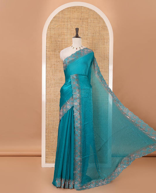 Peacock green full-plain Fendy satin saree, scallop floral micro-stone embroidered border, self-pallu & contrast stone work blouse