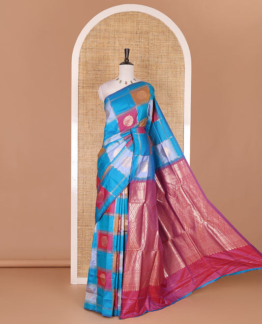 Borderless blue chakra buttas enclosed, checked elite soft silk saree, contrast ogee patterned pallu, and contrast zari design blouse