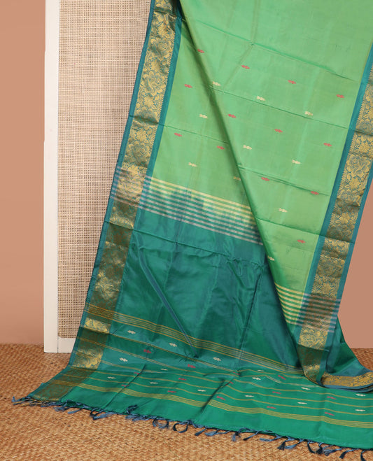 Green Banana Pith Saree, Prettified with Thread Buttas All Over Its Body, Complemented by a Contrast Floral Creeper Design Woven Border, Pallu Steeped with Stripes and Buttas, and Paired with a Contrast Blouse