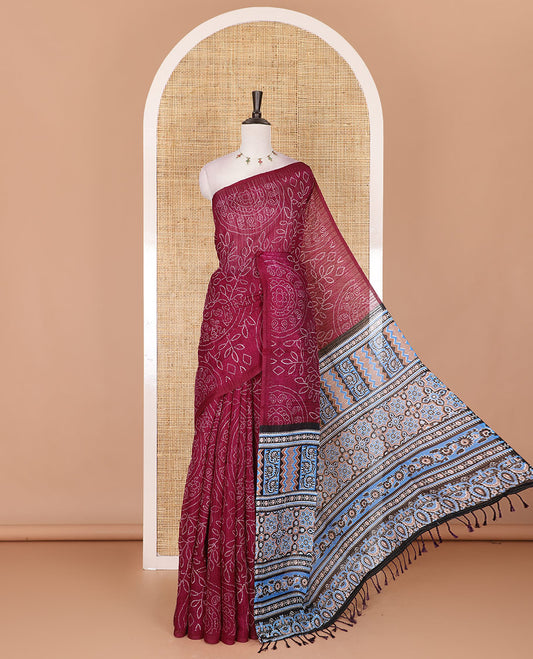 Borderless wine bandhani style floral, paisley, and chakra printed semi-jute silk saree, contrast ajrakh printed pallu, and ajrakh printed blouse