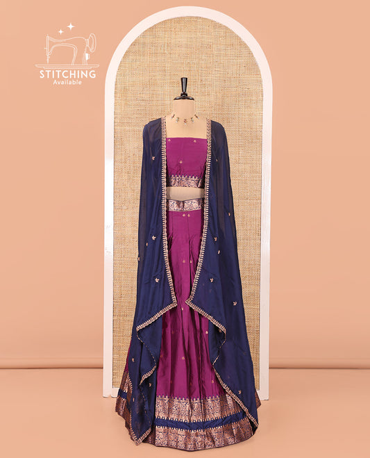 Dark Magenta and Blue Semi-Banarasi Half-Saree, Accentuated with Zari Buttas on Its Skirt, Complemented by a Contrast Rettai Pettu Traditional Zari-Design Border, Paired with a Matching Blouse, and Comes with a Contrast Satin Georgette Embroidered Dhavani