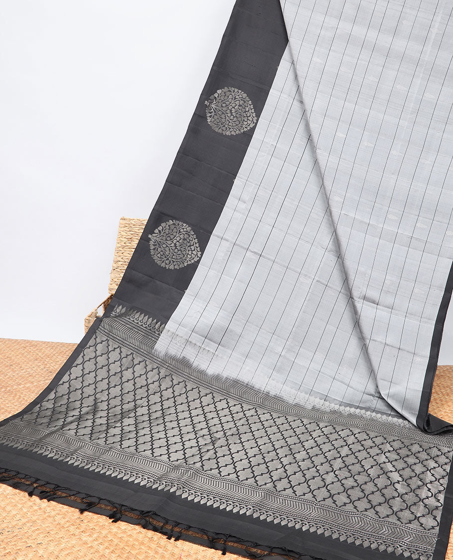 Grey checked Mayur soft silk saree with contrast leaf motifs border & argyle pattern pallu