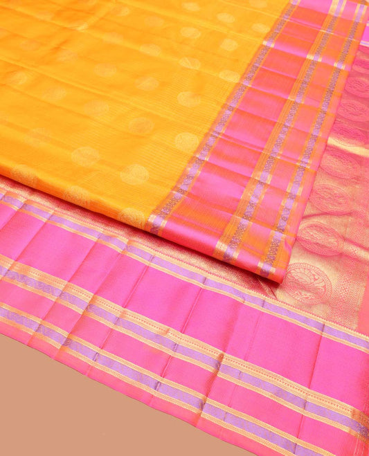 Yellow Vasundhara Silk Saree, Sparsely Woven with Stripes and Chakram Buttas on Its Body, Complemented by a Contrast Border of Rekku, Bentex, and Kodi Visiry Designs, Grand Jaal Design Pallu, and Paired with a Contrast Blouse