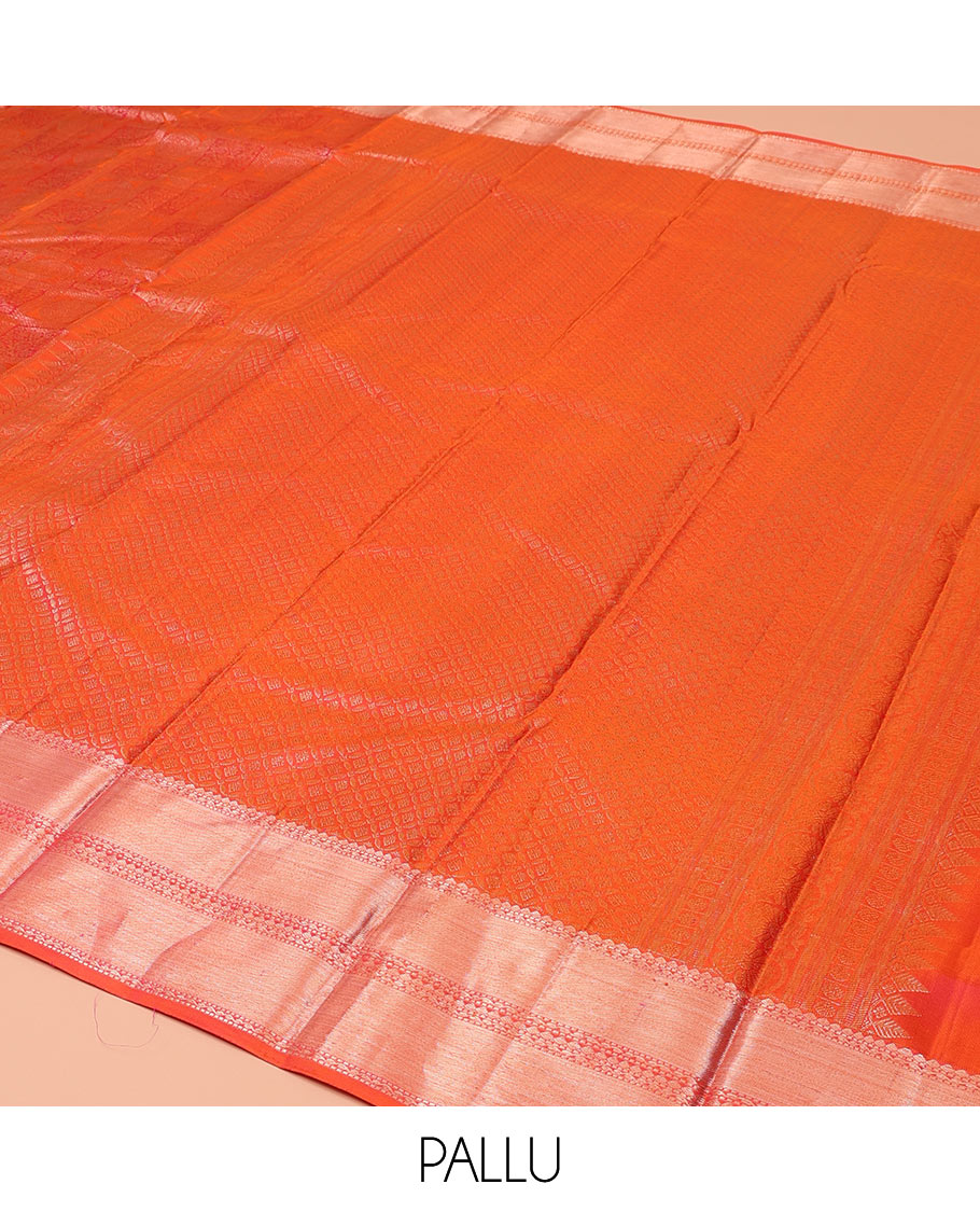 Orange Kanchipuram Wedding Silk Saree, Majestically Detailed with Jacquard Designs on Its Body, Highlighted by a Zari Border of Rekku, Muthu, and Neli Designs, Beautifully Bedecked Pallu, and Paired with a Matching Blouse