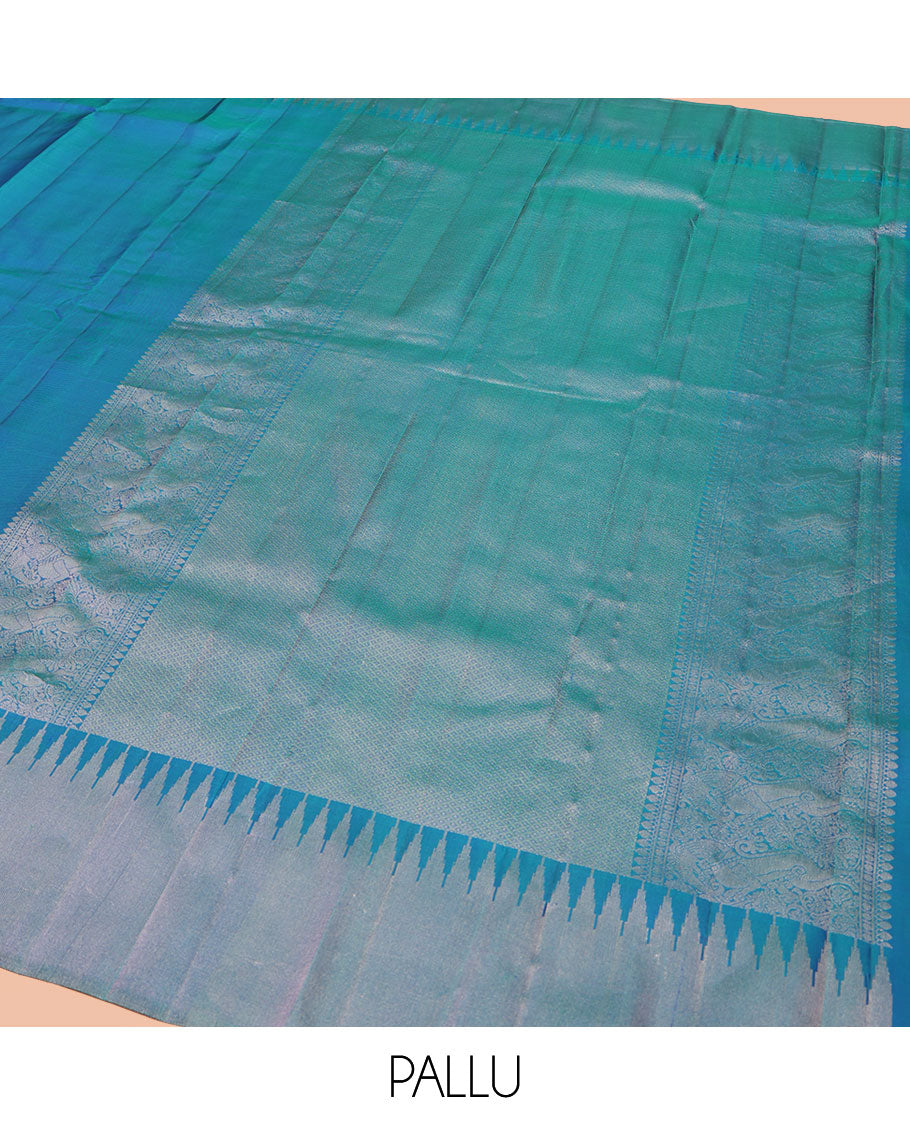 Blue Plain Vasundhara Silk Saree, Highlighted by Thazampoo Rekku Zari Border, Pallu of Mayil Kann, and Yaali Designs, and Paired with a Matching Blouse