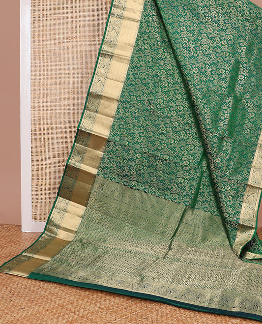 Green floral jacquard kancheepuram silk saree with self border of rekku, paun, banaras design floral pallu