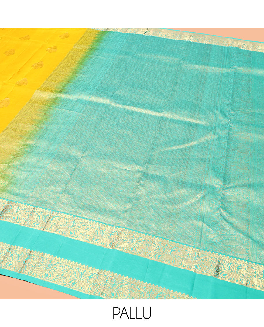 Yellow Vasundhara Silk Saree, Woven with Zari Buttas, Complemented by a Contrast Rettai Pettu Mayil-Yaanai Border, Jaal Pallu, and a Contrast Blouse