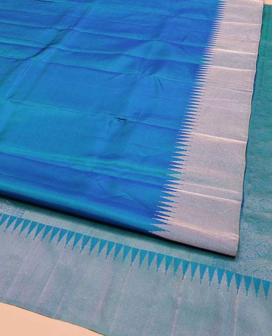 Blue Plain Vasundhara Silk Saree, Highlighted by Thazampoo Rekku Zari Border, Pallu of Mayil Kann, and Yaali Designs, and Paired with a Matching Blouse