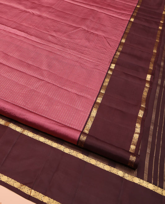Pink Kanchipuram Silk Saree, Subtly Enriched with Zari Stripes All Over Its Body, Complemented by Contrast Rettai Pettu Border of Mayil and Rudraksham Designs, Gleaming Zari-Striped Pallu, and Paired with a Contrast Blouse