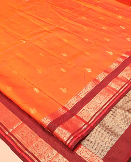 Orange Vasundhara Lite Silk Mix Saree, Accentuated With Zari Buttas All Over Its Body, Complemented by Captivating Contrast Border of Rekku, Mayil, Kuthirai, Yaanai, and Neli Designs, Grand Pallu, and Paired with a Contrast Blouse