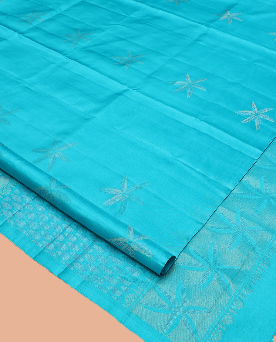 Borderless Blue Mayuri Soft Silk Saree, Sparsely Woven with Floral Buttas All Over Its Body, Sparsely Sparkled Pallu, and Paired with a Matching Blouse