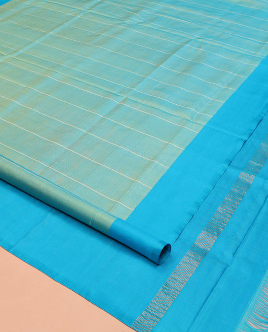 Blue Uppada Silk Saree, Subtly Sparkled with Stripes On Its Body, Complemented by a Contrast Plain Border, Plain Pallu, and Paired with a Contrast Blouse