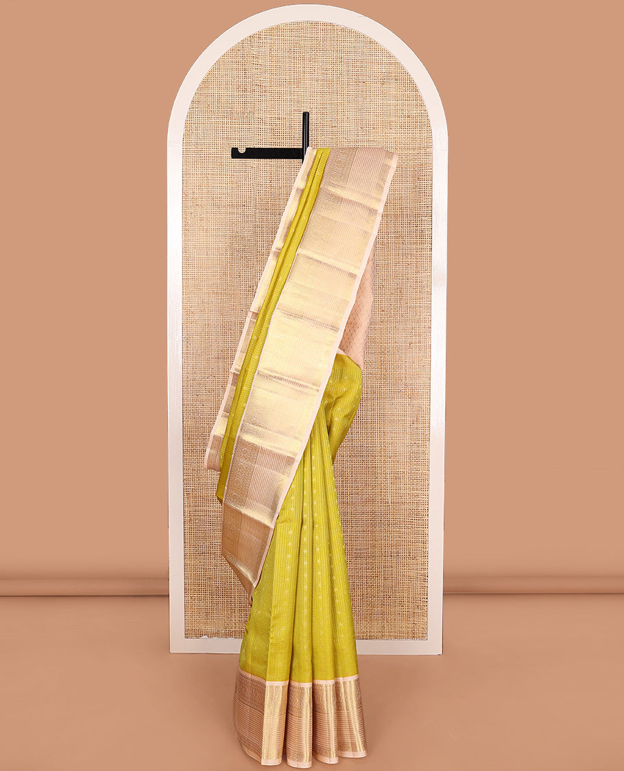 Yellow zari buttas and micro-checked Vasundhara silk mix saree, contrast border of thilakam mokku, banaras, paisa, mayil, banaras, and zari design, and peacock feather motifs pallu