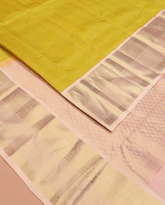 Yellow zari buttas and micro-checked Vasundhara silk mix saree, contrast border of thilakam mokku, banaras, paisa, mayil, banaras, and zari design, and peacock feather motifs pallu