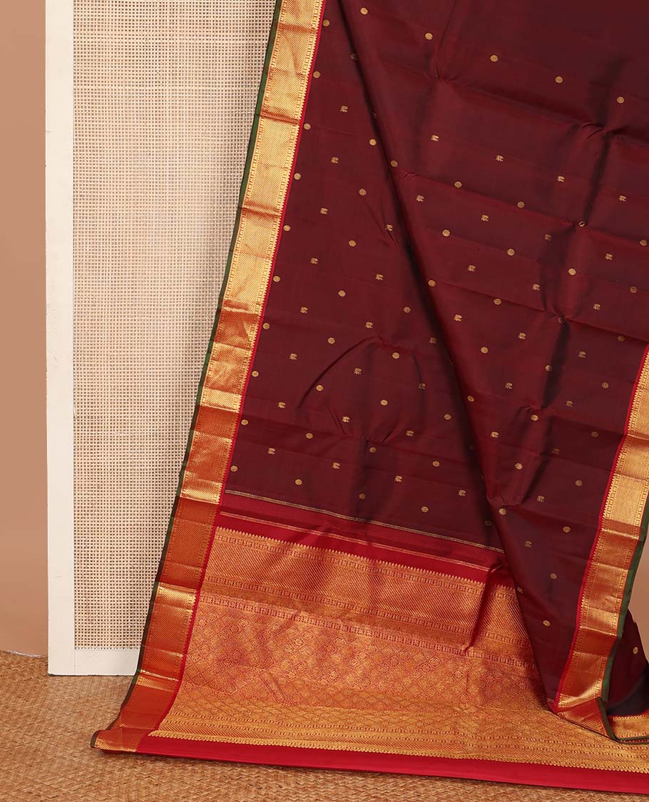 Maroon mayil poun buttas Kanchipuram silk saree, contrast border of rekku, banaras, cross kamalam, and zari stripes, and zari rich jaal pallu