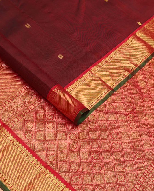 Maroon mayil poun buttas Kanchipuram silk saree, contrast border of rekku, banaras, cross kamalam, and zari stripes, and zari rich jaal pallu