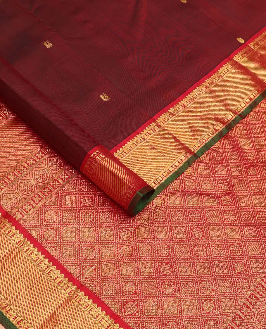 Maroon mayil poun buttas Kanchipuram silk saree, contrast border of rekku, banaras, cross kamalam, and zari stripes, and zari rich jaal pallu