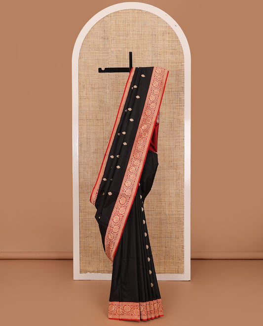 Black zari buttas katan silk saree, contrast floral creeper zari border, and floral and paisley jaal pallu