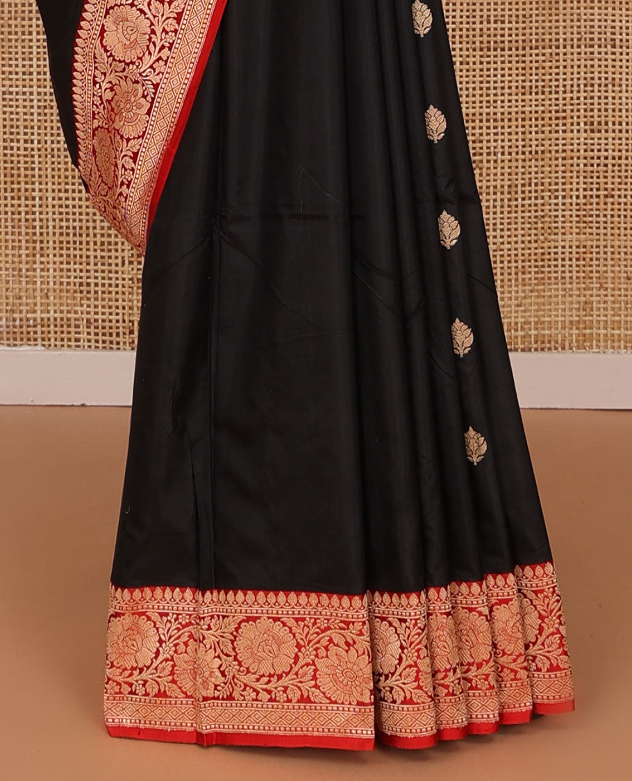 Black zari buttas katan silk saree, contrast floral creeper zari border, and floral and paisley jaal pallu