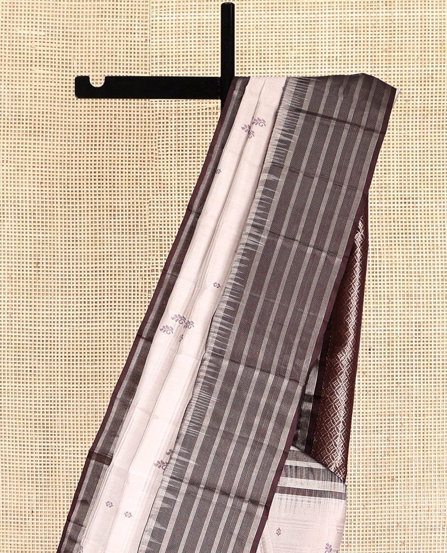 Off-White Kanchipuram Silk Saree, Subtly Sparkled with Buttas and Stripes, Complemented by Contrast Zari Striped Border, Pallu of Intricate Designs, and a Contrast Blouse