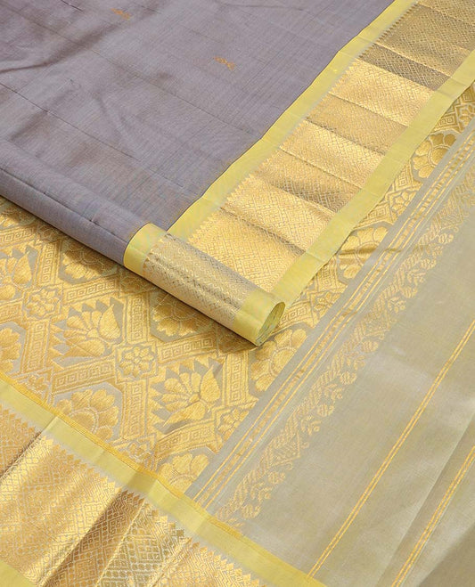Grey buttas kancheepuram silk saree with contrast border of intricate zari design & floral design pallu