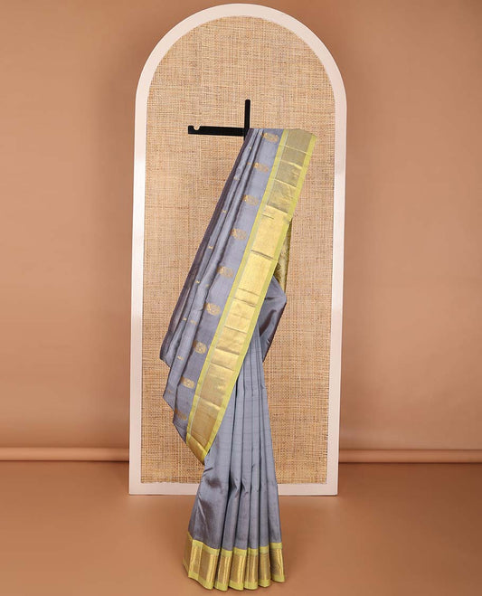 Grey buttas kancheepuram silk saree with contrast border of intricate zari design & floral design pallu
