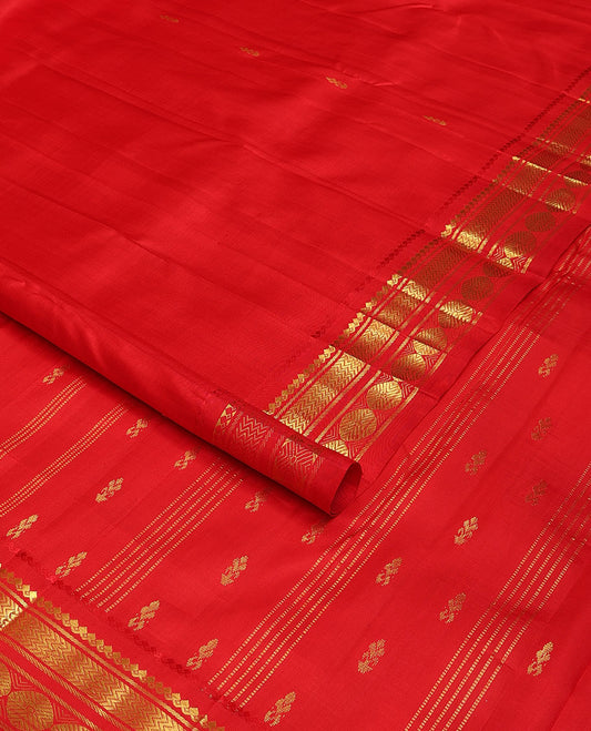 Red zari buttas woven Kanchipuram silk saree, zari one-sided border of thilakam mokku,banaras,vanki & poun designs  & pallu of muthu stripes & zari buttas