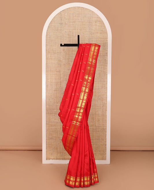 Red zari buttas woven Kanchipuram silk saree, zari one-sided border of thilakam mokku,banaras,vanki & poun designs  & pallu of muthu stripes & zari buttas