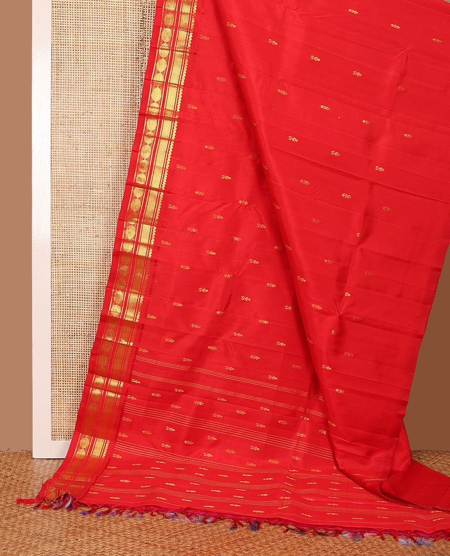 Red zari buttas woven Kanchipuram silk saree, zari one-sided border of thilakam mokku,banaras,vanki & poun designs  & pallu of muthu stripes & zari buttas