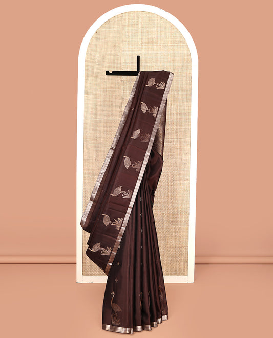Brown Mayuri Soft Silk Saree, Spotlighted with Zari Buttas All Over Its Body, Highlighted by Piping Zari Border, Intricately Designed Pallu and Paired with a Matching Blouse
