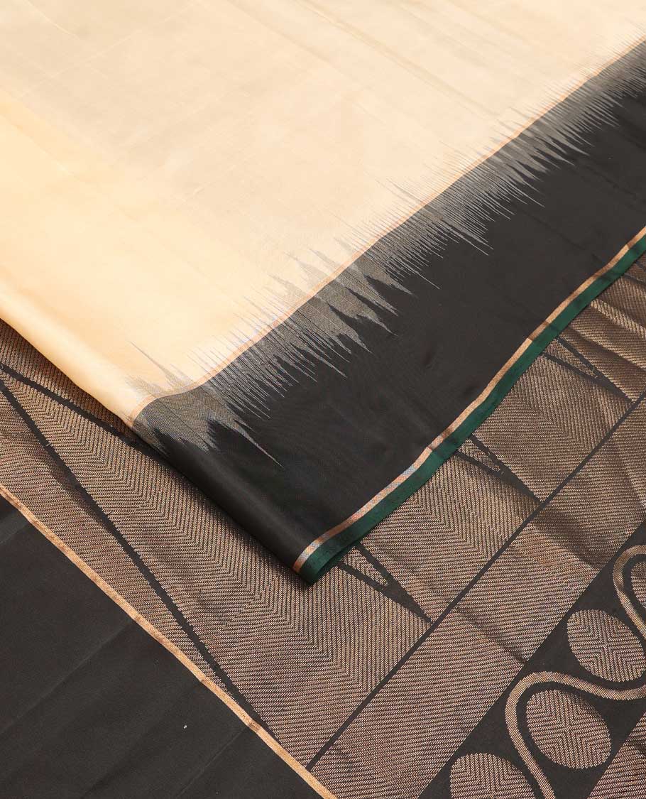 Cream soft silk saree, contrast zari border, and zari-rich pallu of temple and kodi rudraksham designs