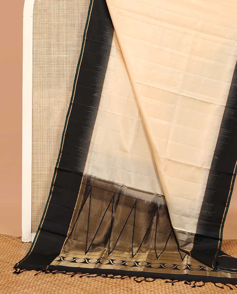 Cream soft silk saree, contrast zari border, and zari-rich pallu of temple and kodi rudraksham designs