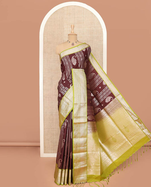Maroon Semi-Soft Silk Saree Prettified with Paisley and Zari Design, Complemented by Contrast Traditional Zari Design Border, Majestically Detailed Pallu of Intricate Designs, and Paired with a Contrast Blouse