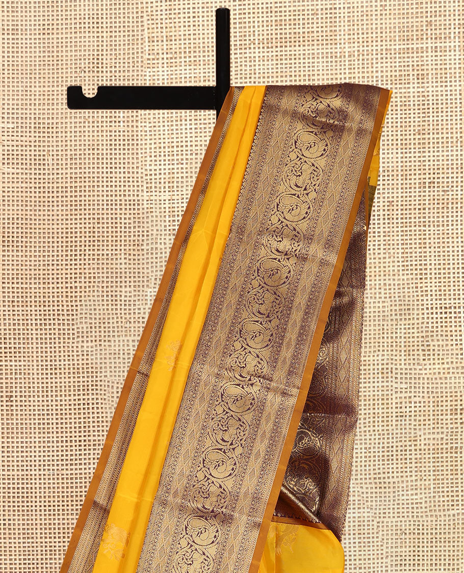 Yellow Vasundhara Lite Silk Mix Saree, Sparsely Woven with Zari Buttas, a Contrast Border of Mayil and Yaali Designs, Grand Pallu, and a Contrast Blouse