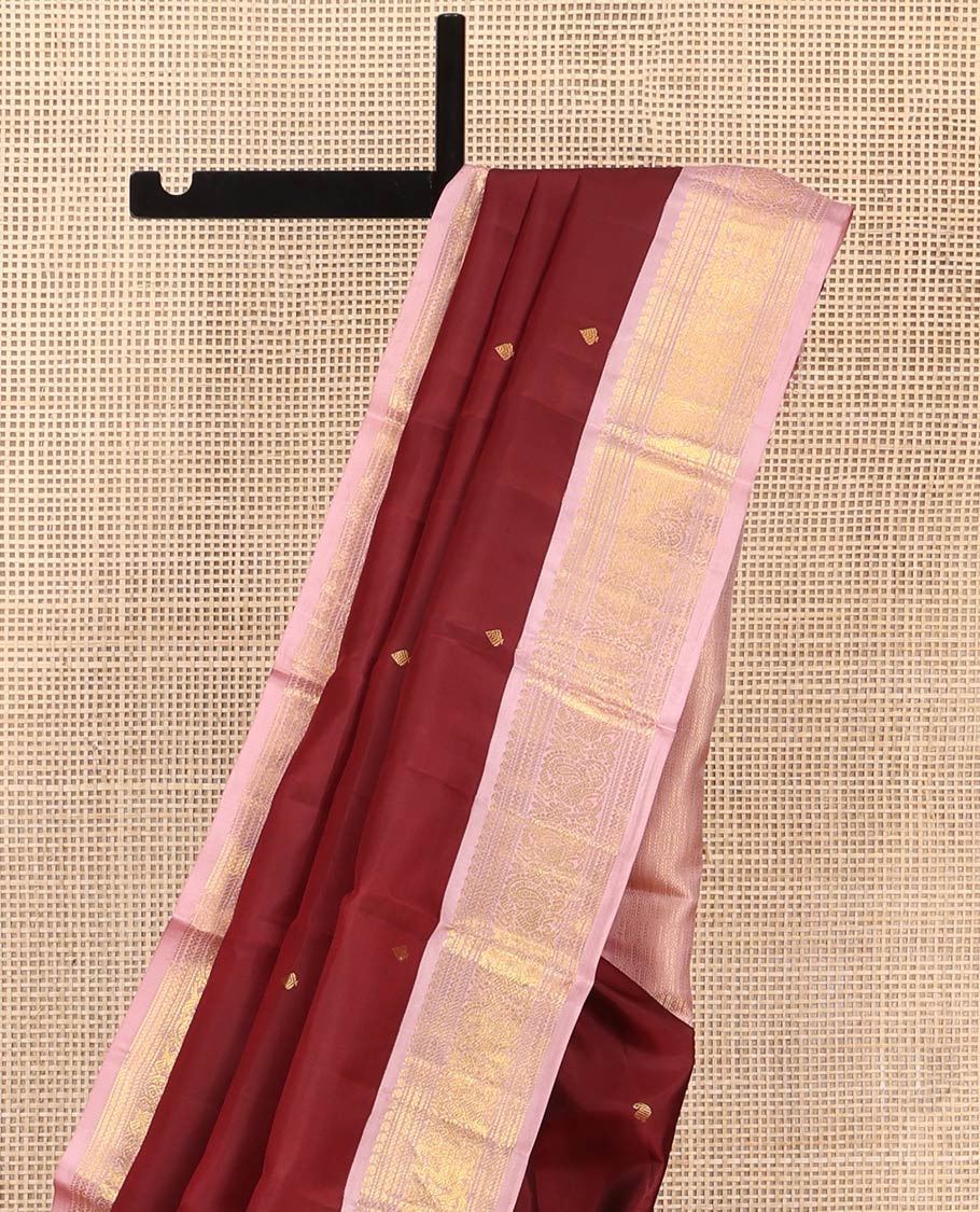 Maroon Vasundhara Silk Saree, Embellished with Zari Buttas All Over Its Body, Complemented by a Contrast Border of Manga, Banaras, Muthu, Neli, and Mayil Designs, Grand Pallu, and Paired with a Contrast Blouse