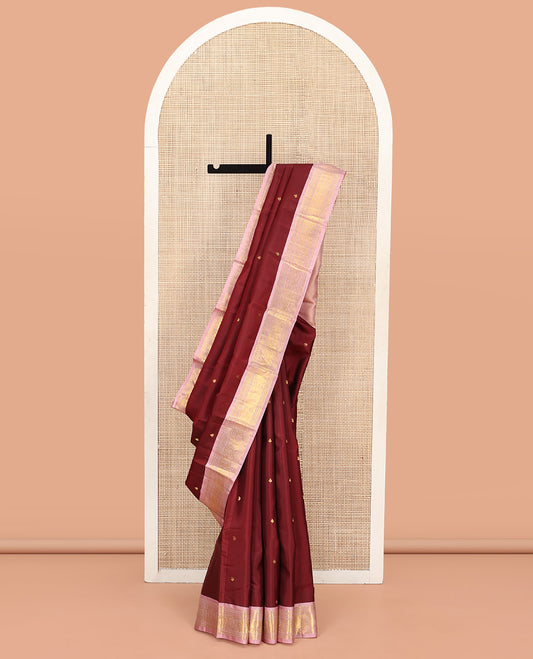 Maroon Vasundhara Silk Saree, Embellished with Zari Buttas All Over Its Body, Complemented by a Contrast Border of Manga, Banaras, Muthu, Neli, and Mayil Designs, Grand Pallu, and Paired with a Contrast Blouse